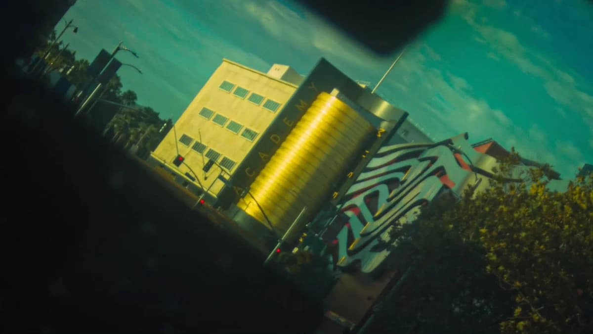 An angled view of Los Angeles buildings in golden light with a teal sky