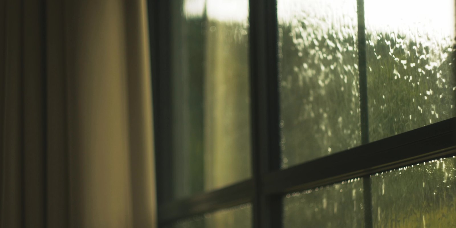 Rain-covered glass in an atmospheric film still from La Vialette by Feel Inc.