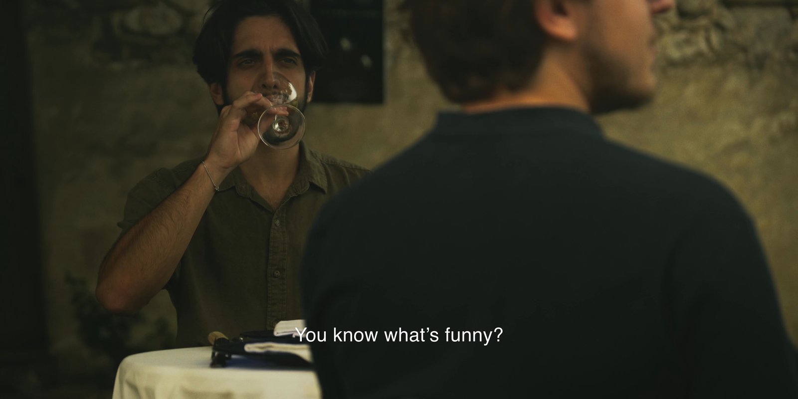 Théo Miranda seated at a table in the Feel Inc. short film Why Not Before